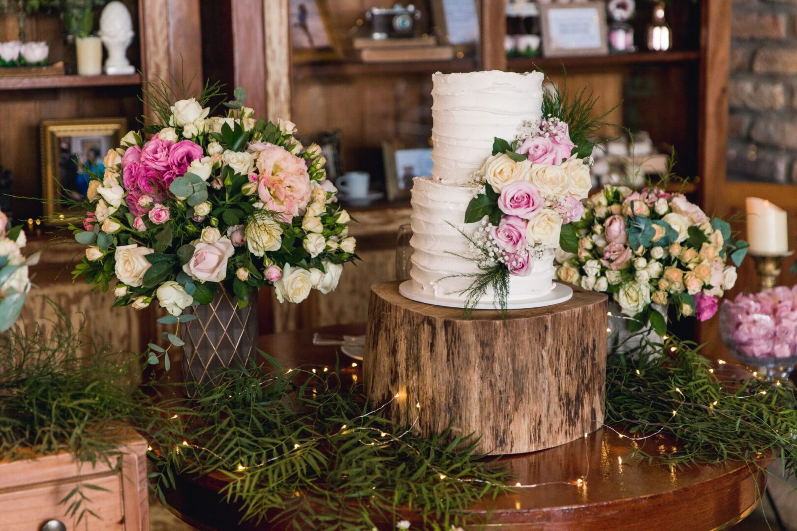 Beautiful wedding cake and flowers on a table