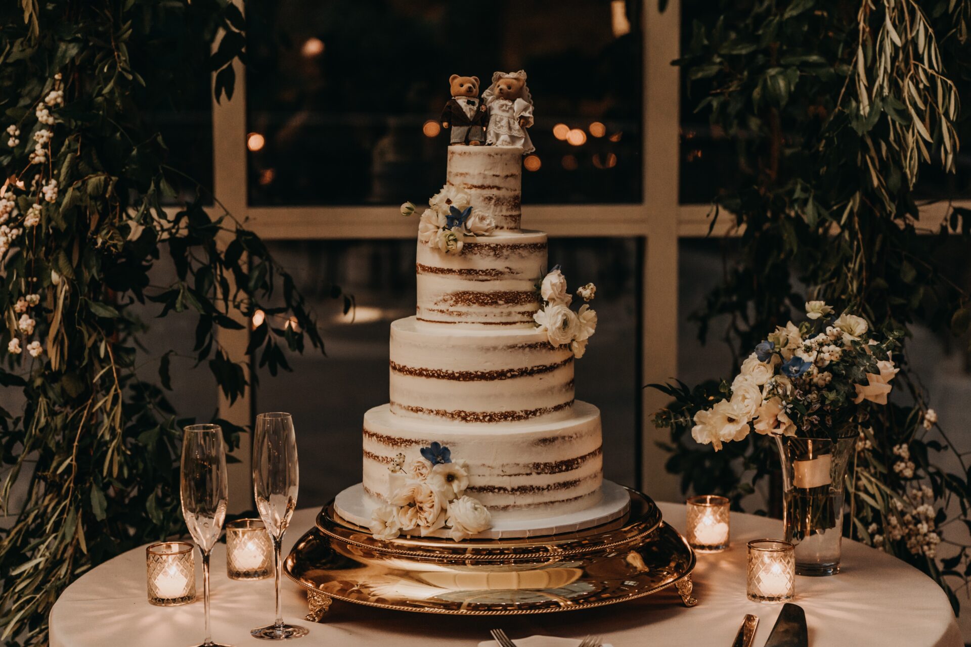 a four layers naked wedding cake
